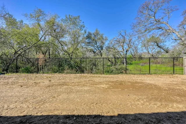 a house with trees in the background