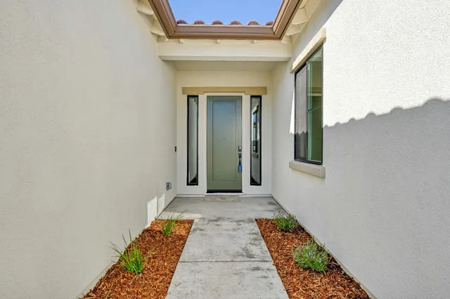 a view of hallway with wooden floor