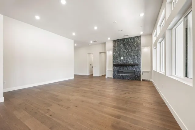 a kitchen with white cabinets stainless steel appliances and sink