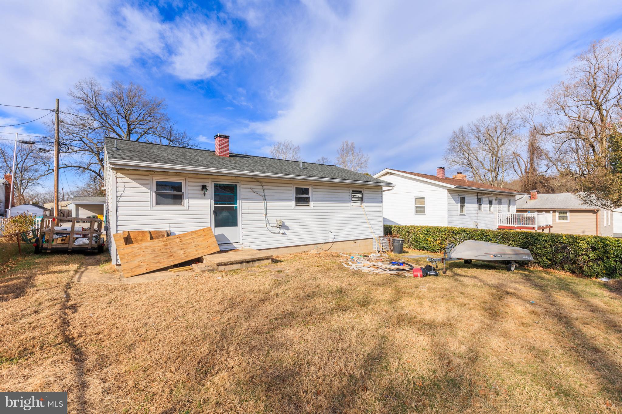 206 Highland Road Glen Burnie, MD 21060 - Photo 2 of 4 a view of a house with snow on the road