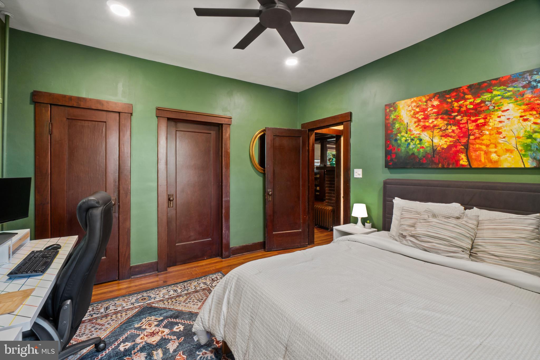 2900 Rueckert Avenue Baltimore, MD 21214 - Photo 20 of 40 a bedroom with a bed and a flat screen tv