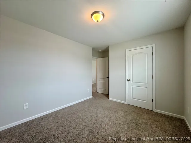 a view of an empty room and a mirror