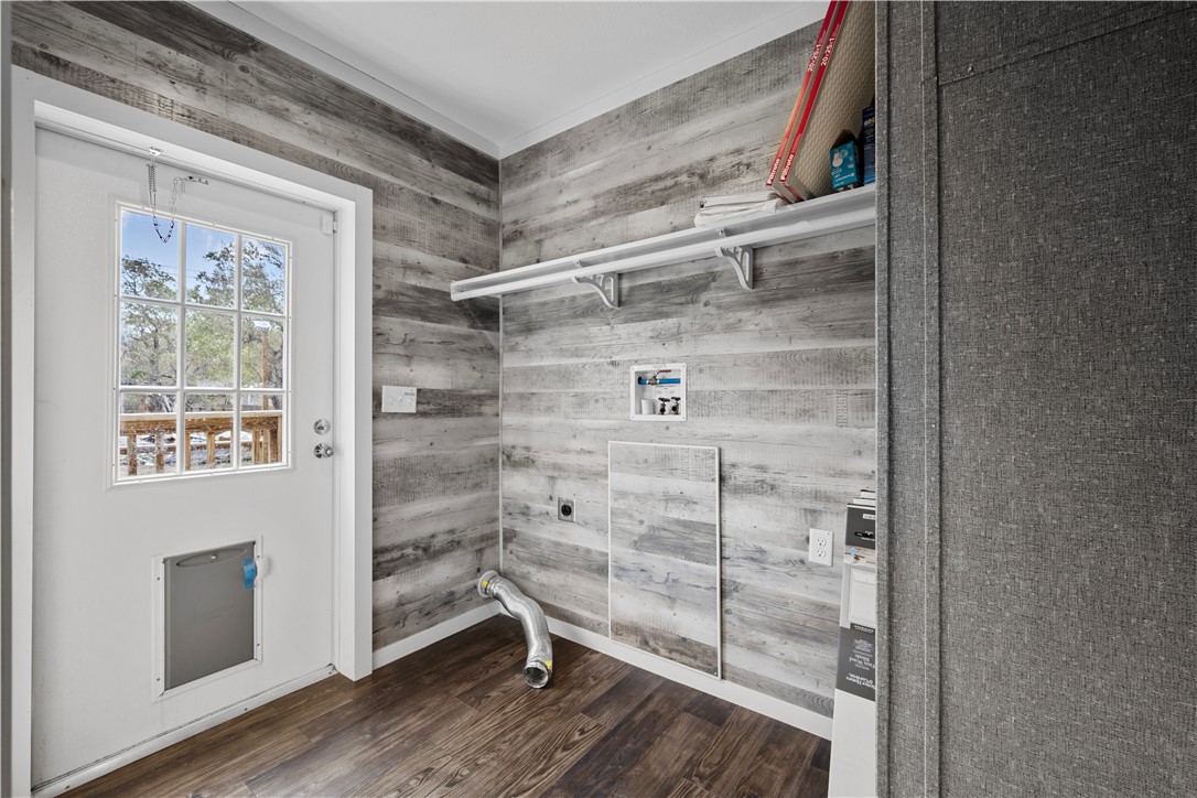 1511 Monkey Road Rockport, TX 78382 - Photo 19 of 40 a view of an empty room with wooden floor and a window