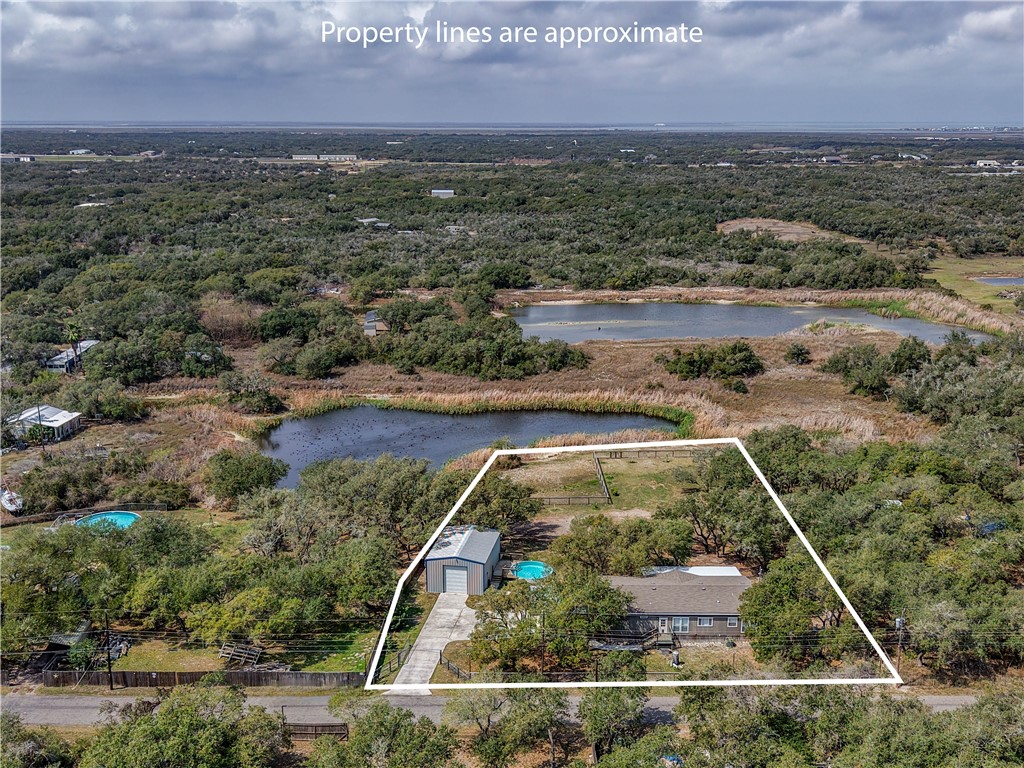 1511 Monkey Road Rockport, TX 78382 - Photo 2 of 40 an aerial view of a houses with a yard