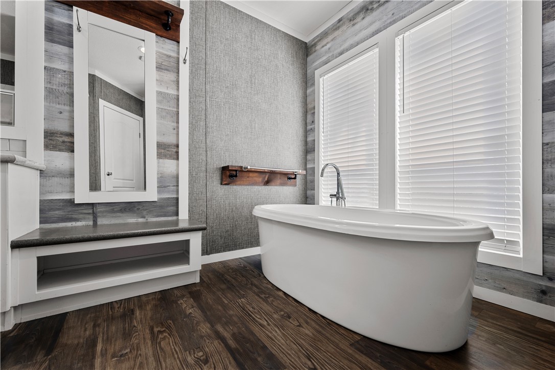 1511 Monkey Road Rockport, TX 78382 - Photo 26 of 40 a bathroom with a sink and a mirror