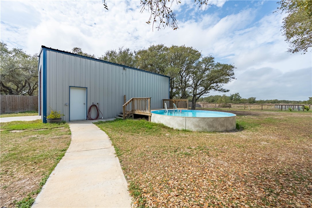 1511 Monkey Road Rockport, TX 78382 - Photo 33 of 40 a view of a backyard with swimming pool