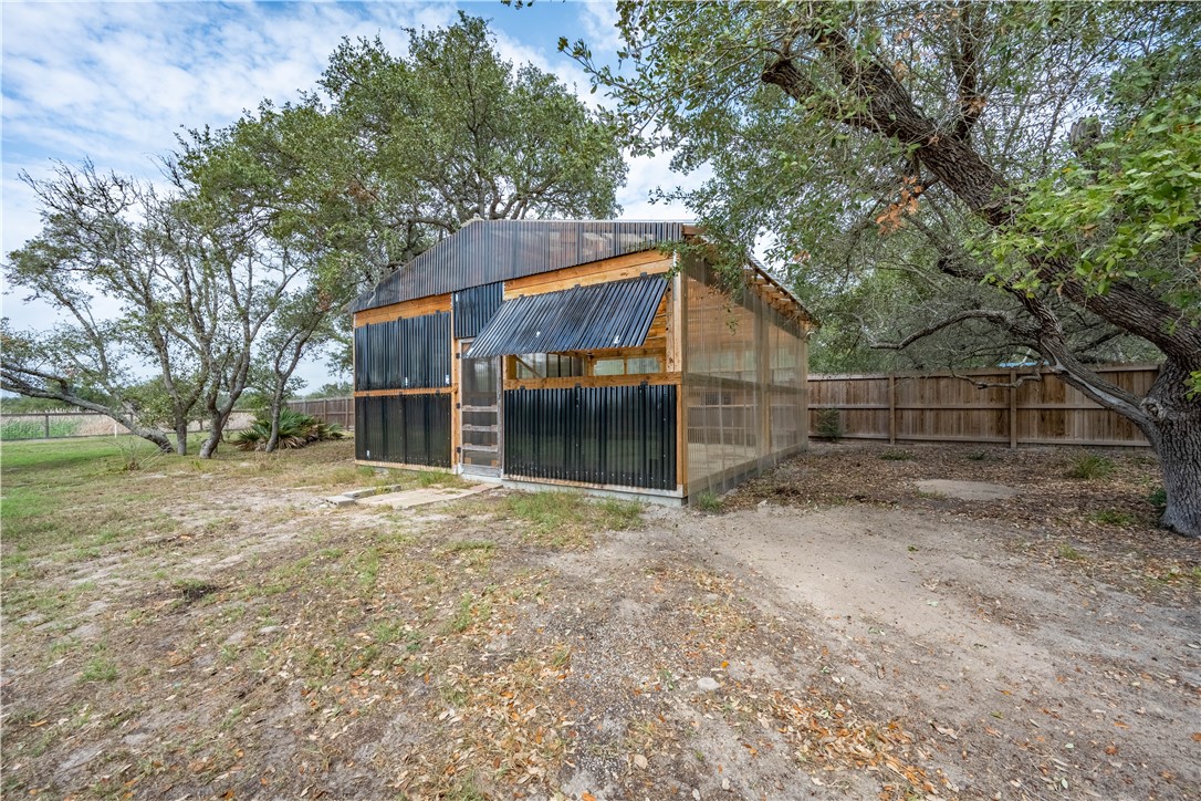1511 Monkey Road Rockport, TX 78382 - Photo 38 of 40 a view of a house with a yard