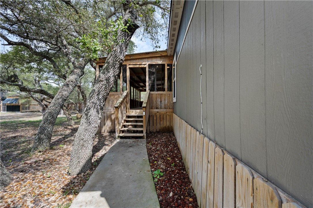 1511 Monkey Road Rockport, TX 78382 - Photo 8 of 40 a view of a house with a small yard