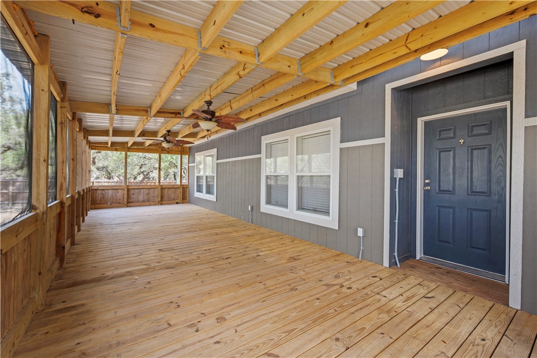 1511 Monkey Road Rockport, TX 78382 - Photo 9 of 40 a big room with wooden floor and windows