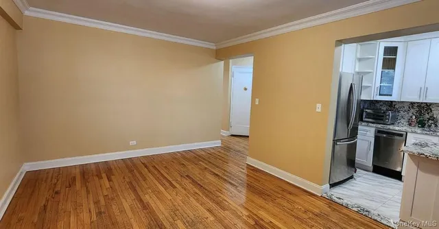 a view of kitchen and wooden floor