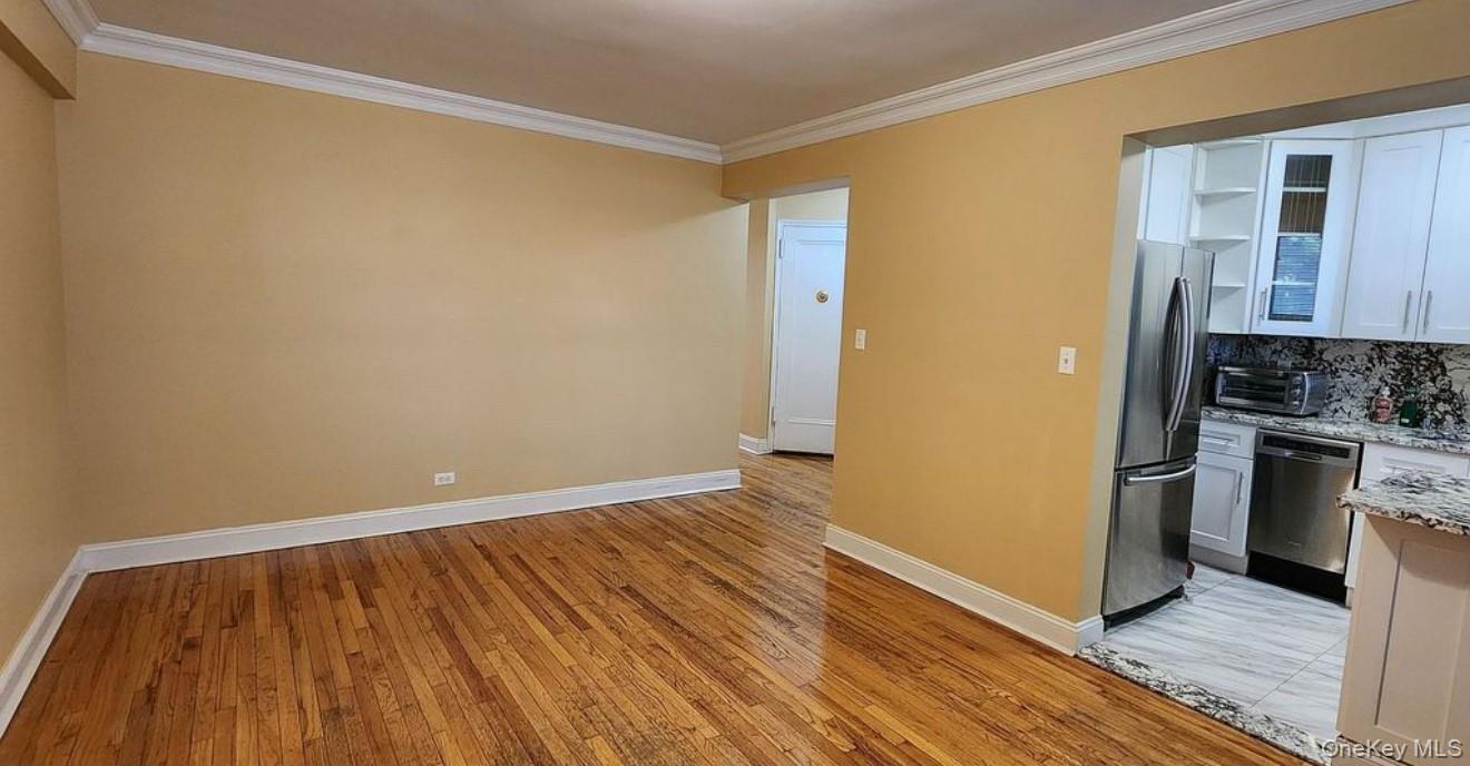 141-39 79th Avenue, Unit 3O Queens, NY 11367 - Photo 7 of 10 a view of kitchen and wooden floor