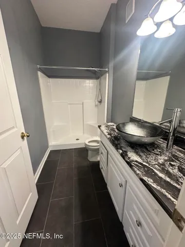 a kitchen with a sink and a stove