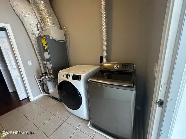 a utility room with dryer and washer
