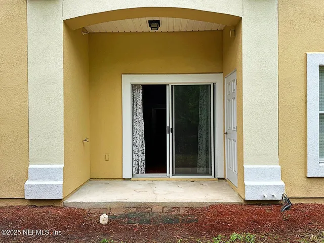 an aerial view of a city and mountain view in back