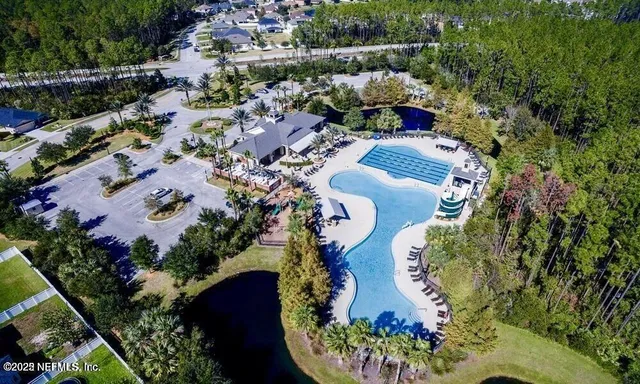 a room with lots of furniture and a wooden floor