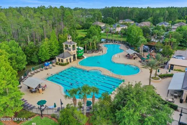 an aerial view of residential houses and outdoor space