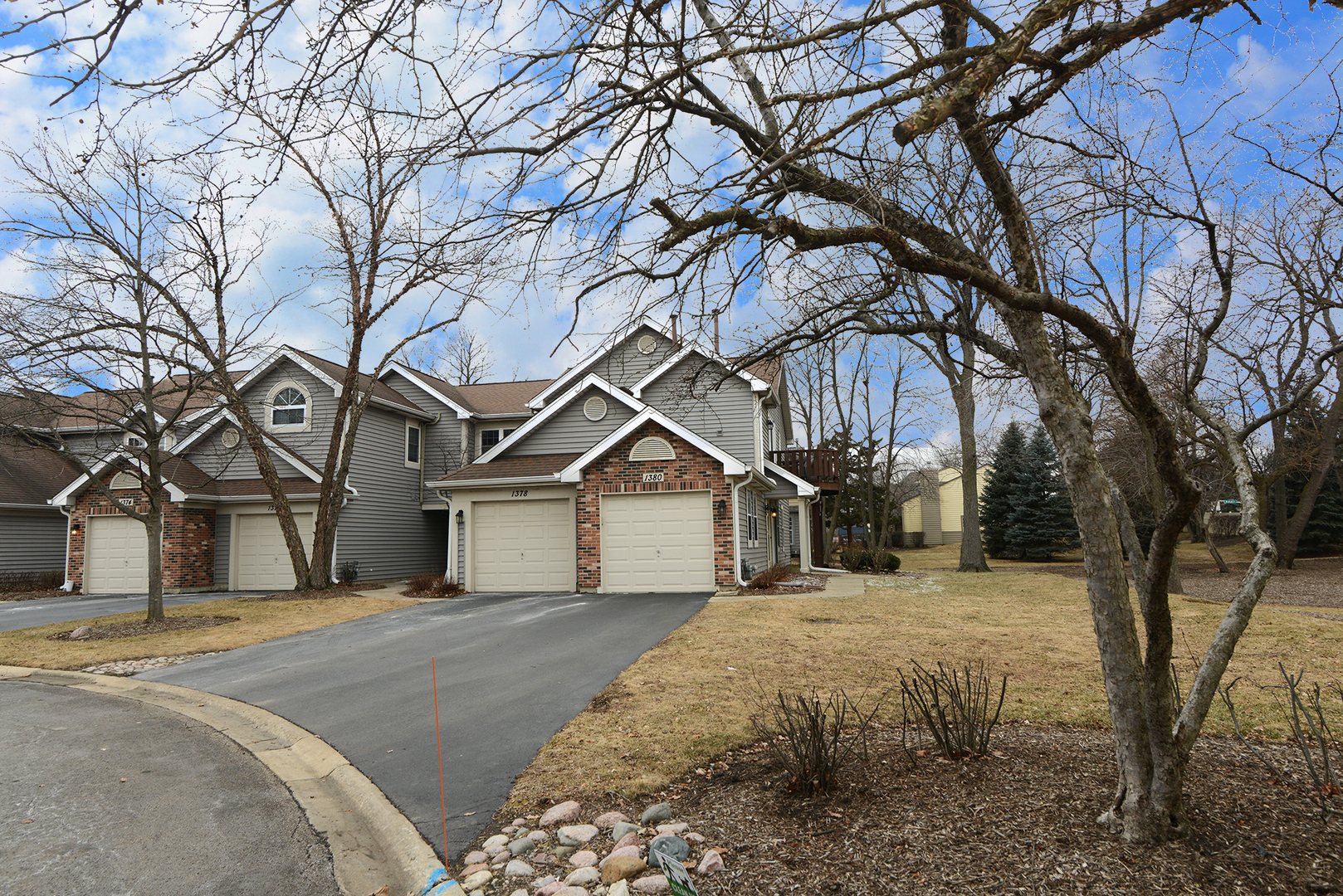 1380 Ridgefield Circle, Unit 1380 Carol Stream, IL 60188 - Photo 4 of 25 a house with trees in front of it