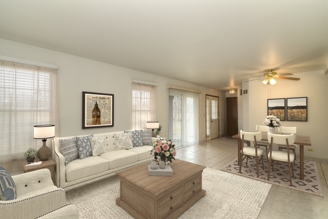 1380 Ridgefield Circle, Unit 1380 Carol Stream, IL 60188 - Photo 6 of 25 a living room with furniture and a large window