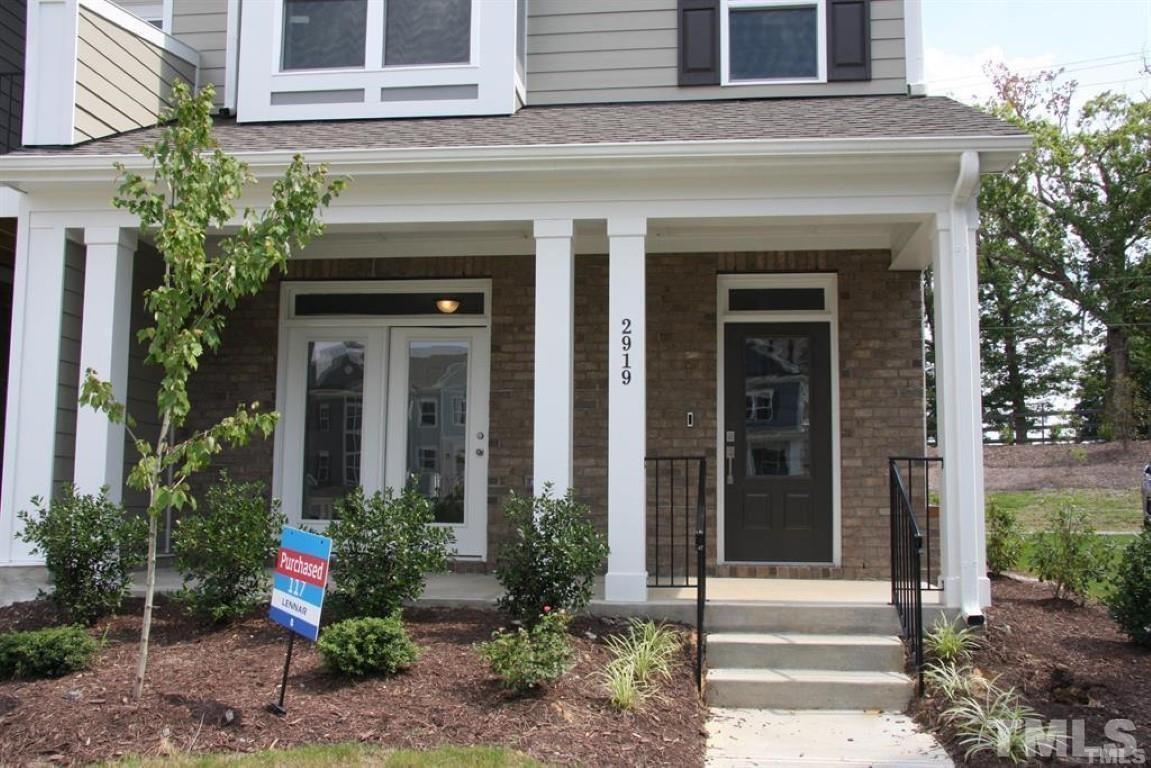2919 Sunflower Road Apex, NC 27502 - Photo 2 of 34 a view of a house with potted plants