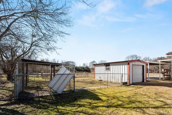 a view of a yard with snow on the road