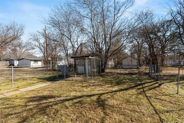 a view of a house with a wooden deck