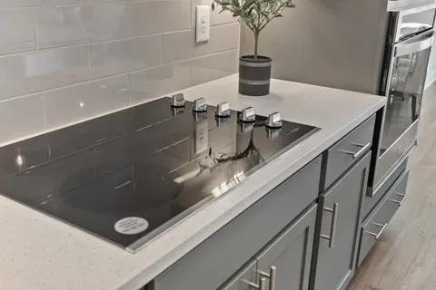 a kitchen with a sink stove and microwave