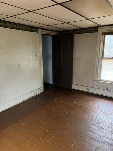 a view of a room has wooden walls