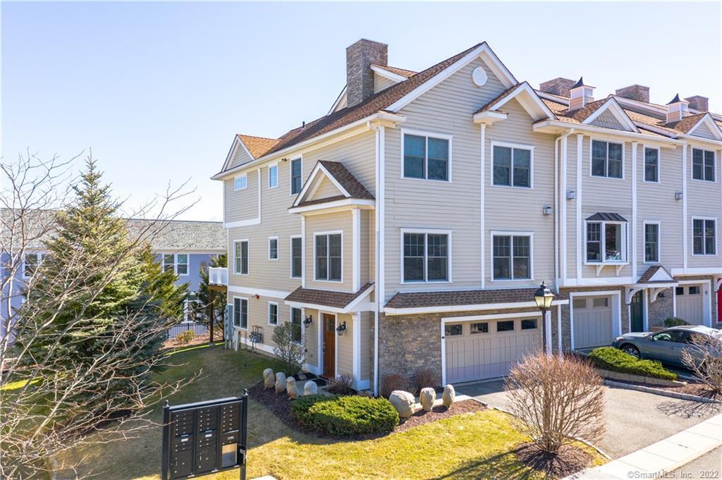 66 Grove Street, Unit C15 Ridgefield, CT 06877 - Photo 1 of 1 a front view of a house with yard and patio