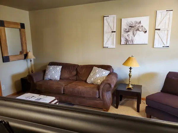 a living room with furniture and a couch