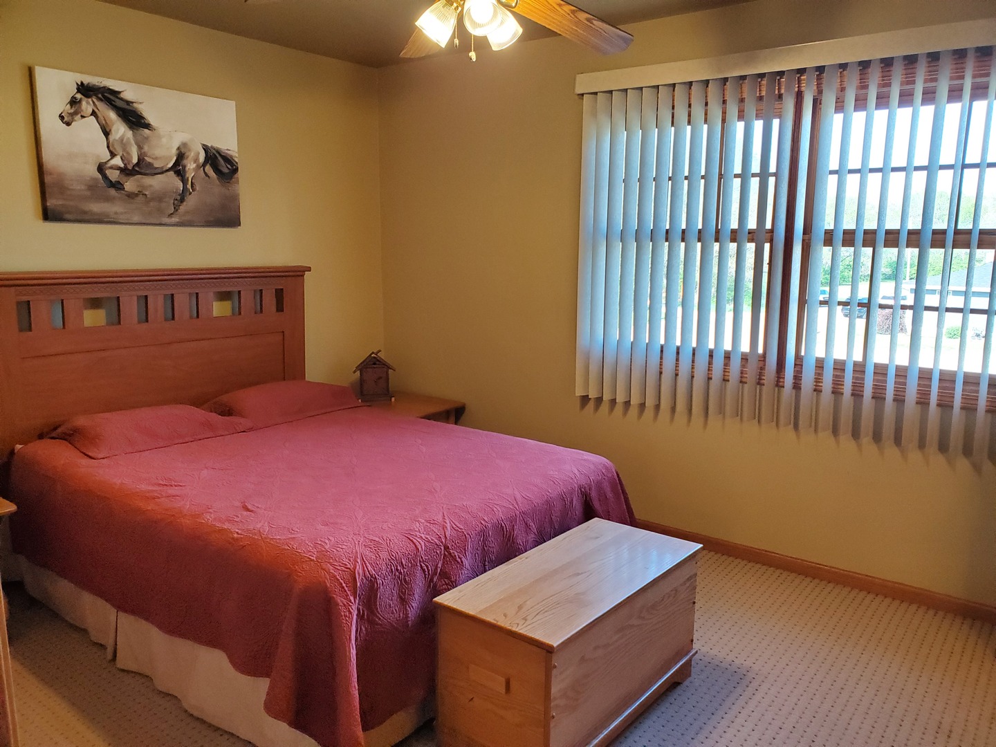 325 South Clark Street, Unit 2C Utica, IL 61373 - Photo 5 of 22 a bedroom with a bed and wooden floor