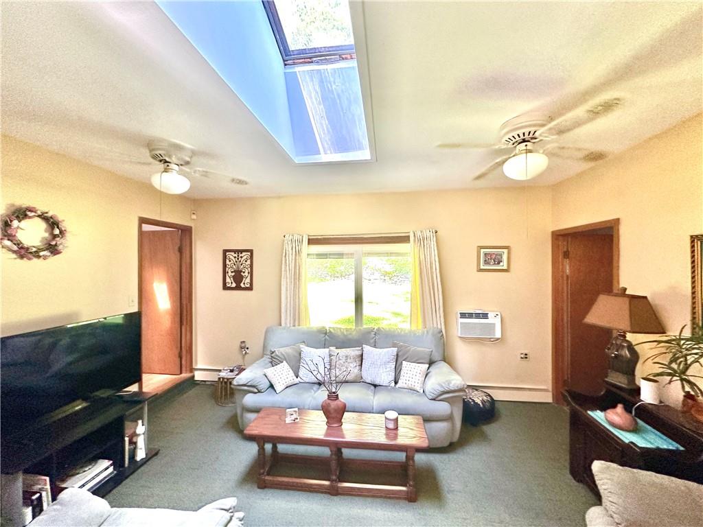 12 Mesmer Hill Road Callicoon, NY 12723 - Photo 6 of 18 Carpeted living room featuring a ceiling skylight,