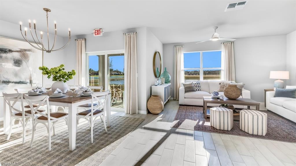 19048 Tangerine Road Fort Myers, FL 33967 - Photo 7 of 14 a living room with furniture and a chandelier