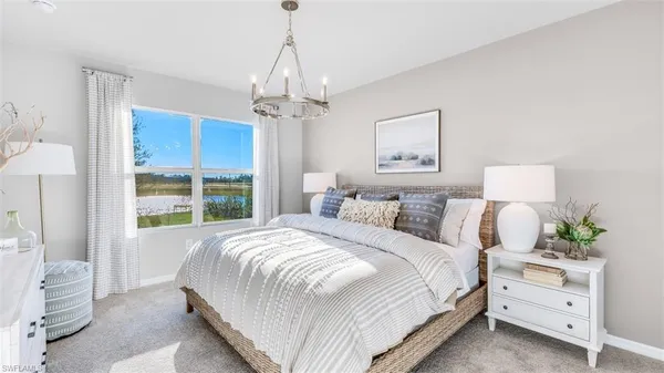 a bedroom with bed and window