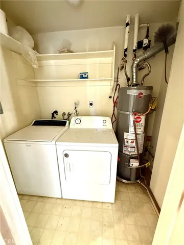 a view of a house with swimming pool and sitting area