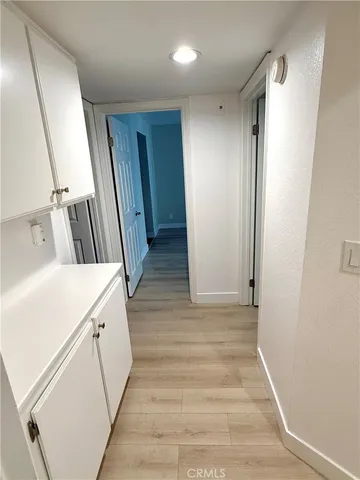 a view of front door with wooden floor