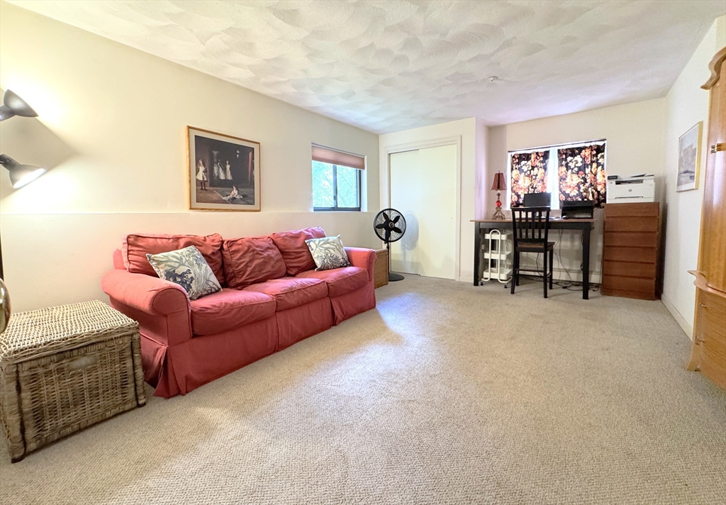 19 Fuller Road, Unit 1 Foxboro, MA 02035 - Photo 10 of 18 a living room with furniture and a window