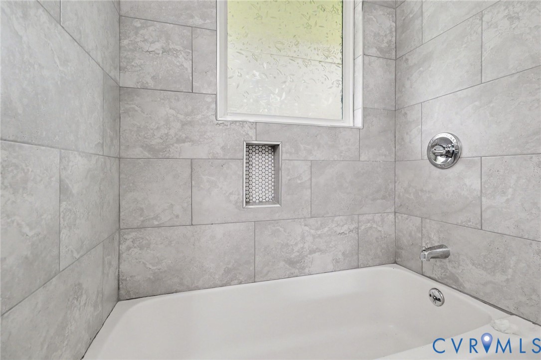 7213 Bennington Road Richmond, VA 23225 - Photo 11 of 24 Bathtub featuring tiled surround, integrated showe