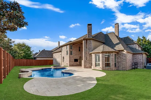 a view of a house with a yard porch and sitting area