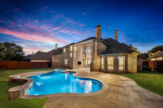 a front view of house with yard and outdoor seating