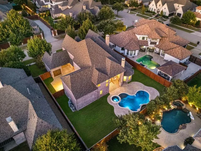 an aerial view of a house roof deck and outdoor space
