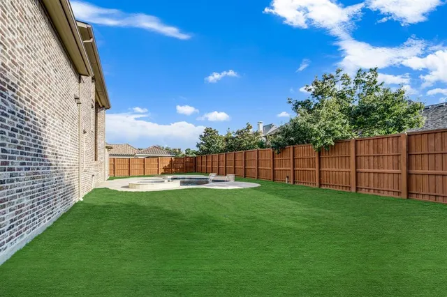 a view of a backyard with a trampoline