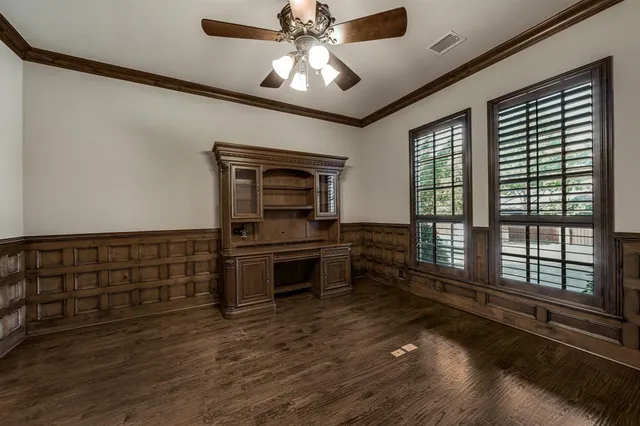 a kitchen with sink and cabinets