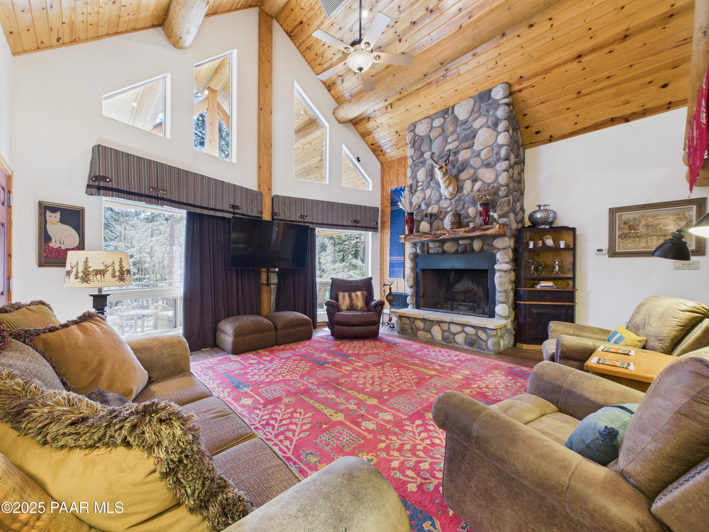 835 Happy Valley Road Prescott, AZ 86305 - Photo 12 of 61 a bedroom with furniture and a fireplace