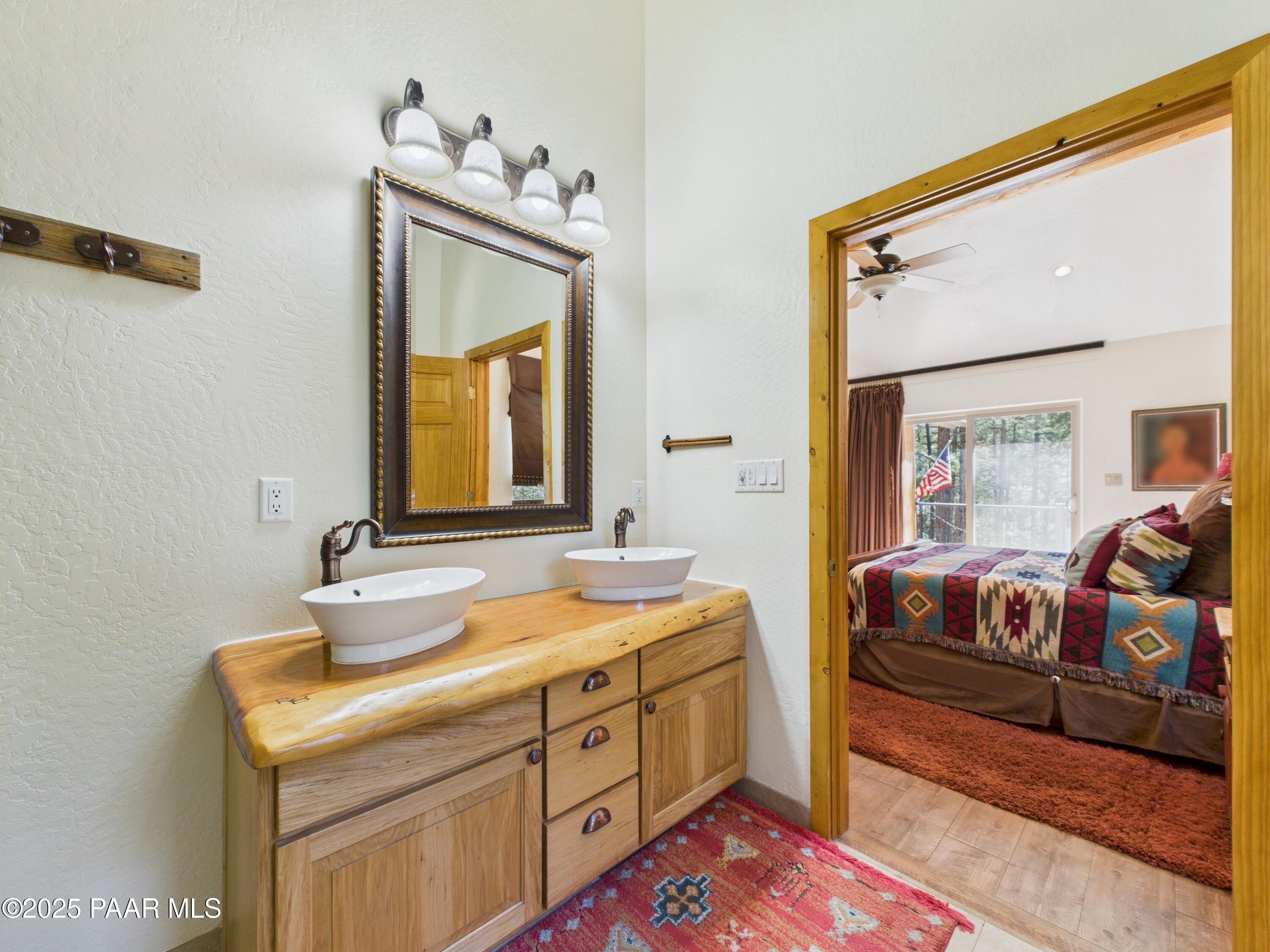 835 Happy Valley Road Prescott, AZ 86305 - Photo 25 of 61 a bedroom with a bed and a dresser