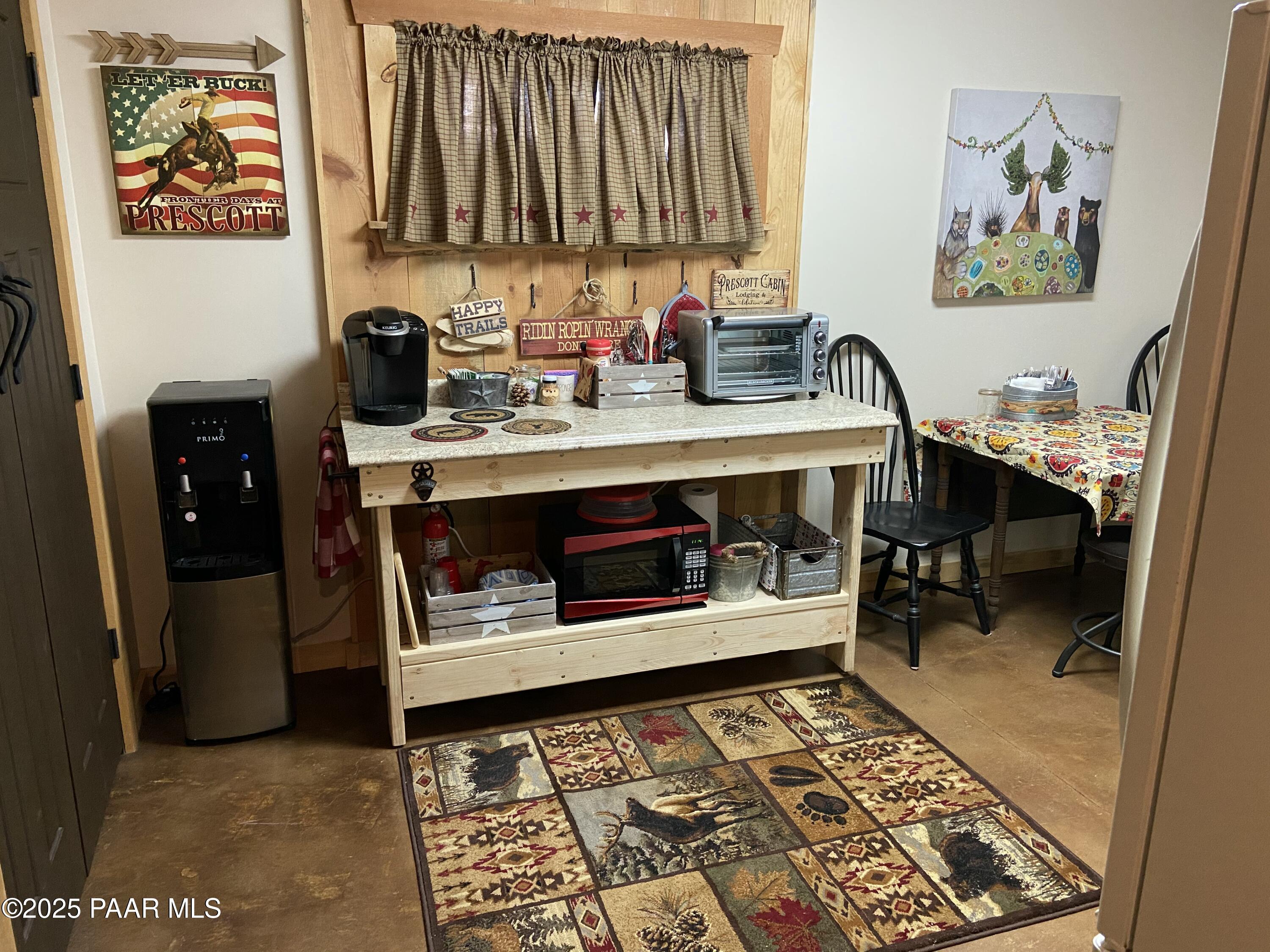 835 Happy Valley Road Prescott, AZ 86305 - Photo 41 of 61 a room with wooden floor and furniture