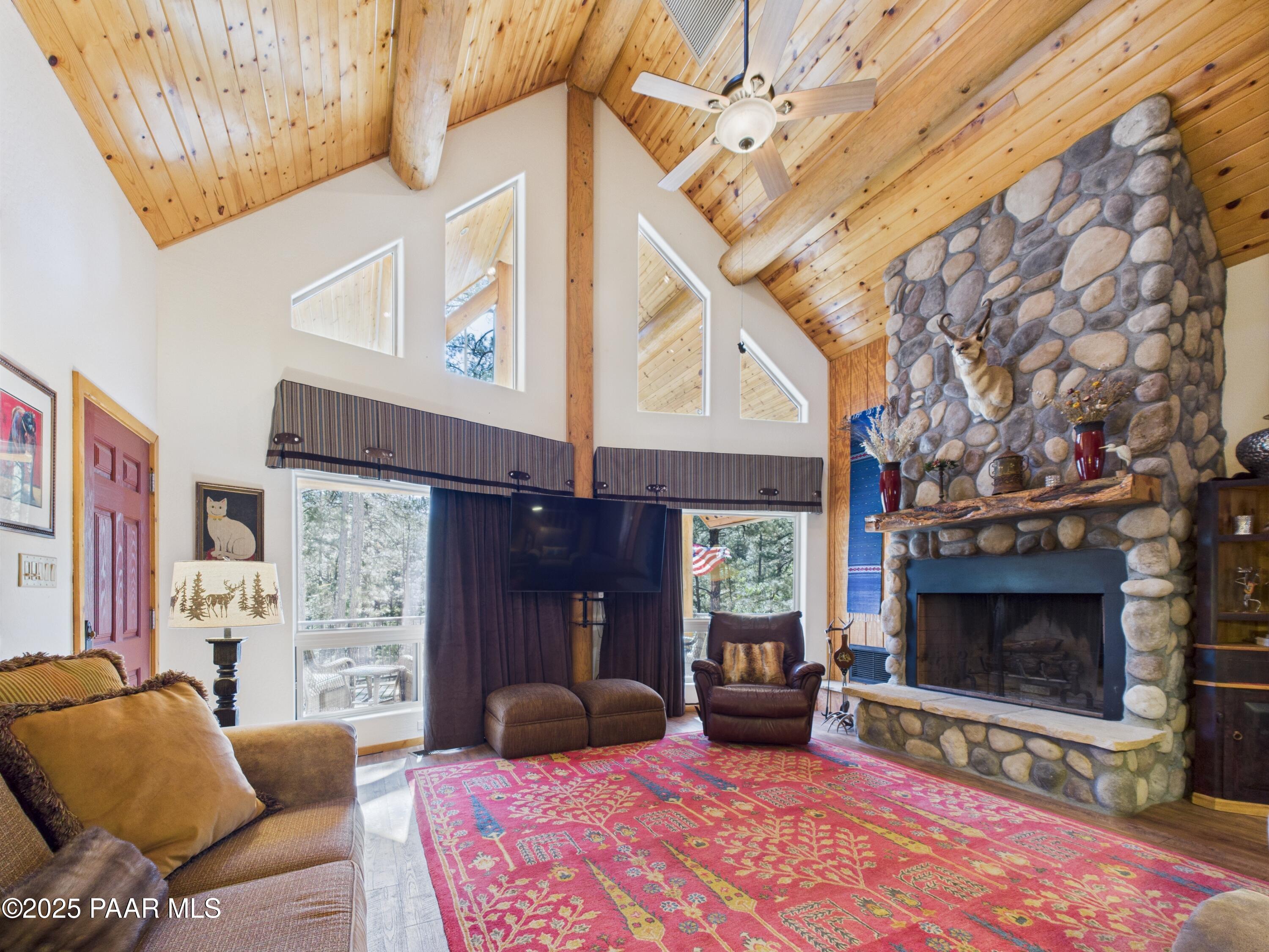 835 Happy Valley Road Prescott, AZ 86305 - Photo 9 of 61 a living room with furniture and a fireplace