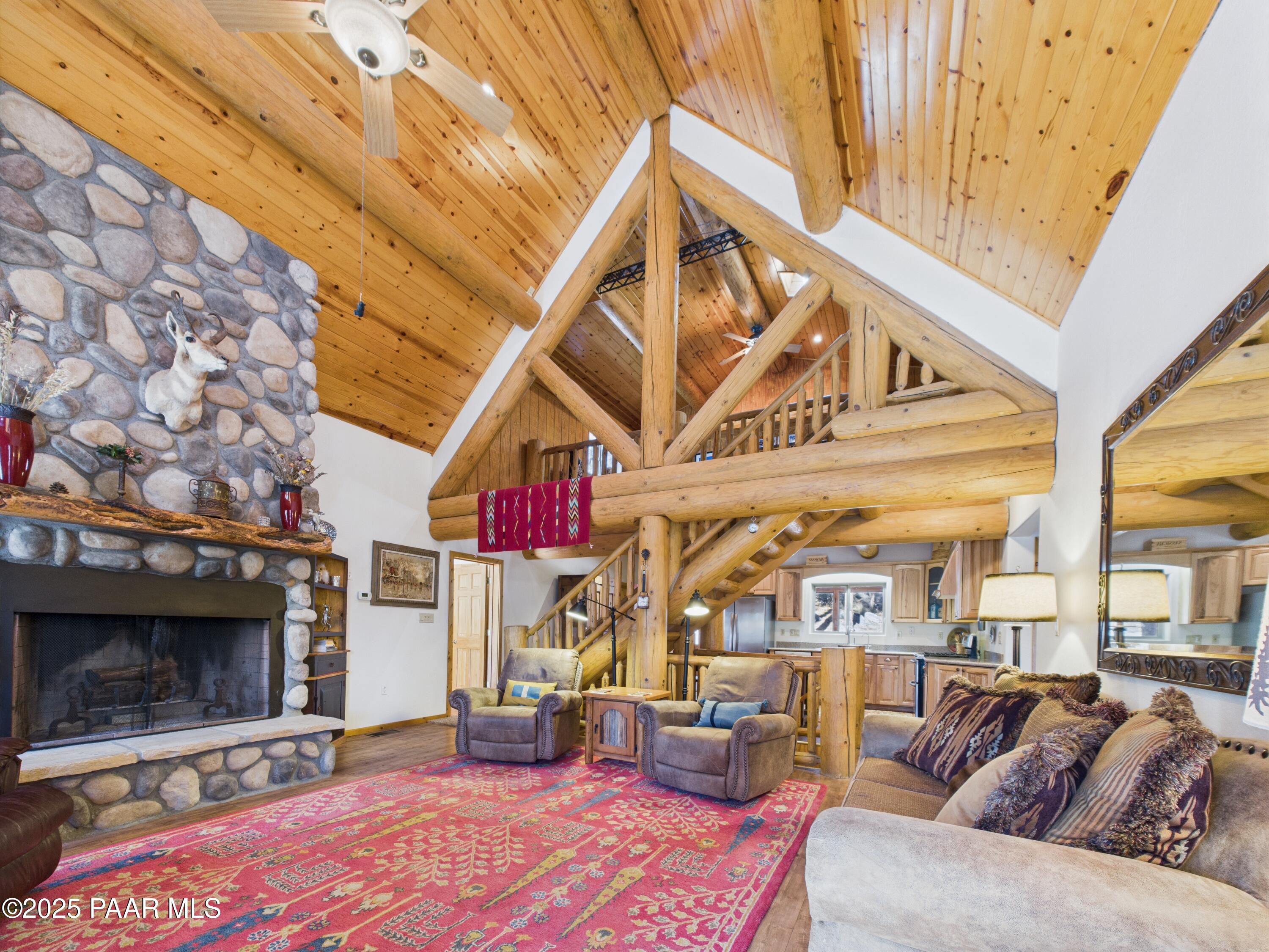 835 Happy Valley Road Prescott, AZ 86305 - Photo 10 of 61 a roof deck with fireplace and dining table