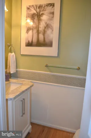 a bathroom with a sink and vanity