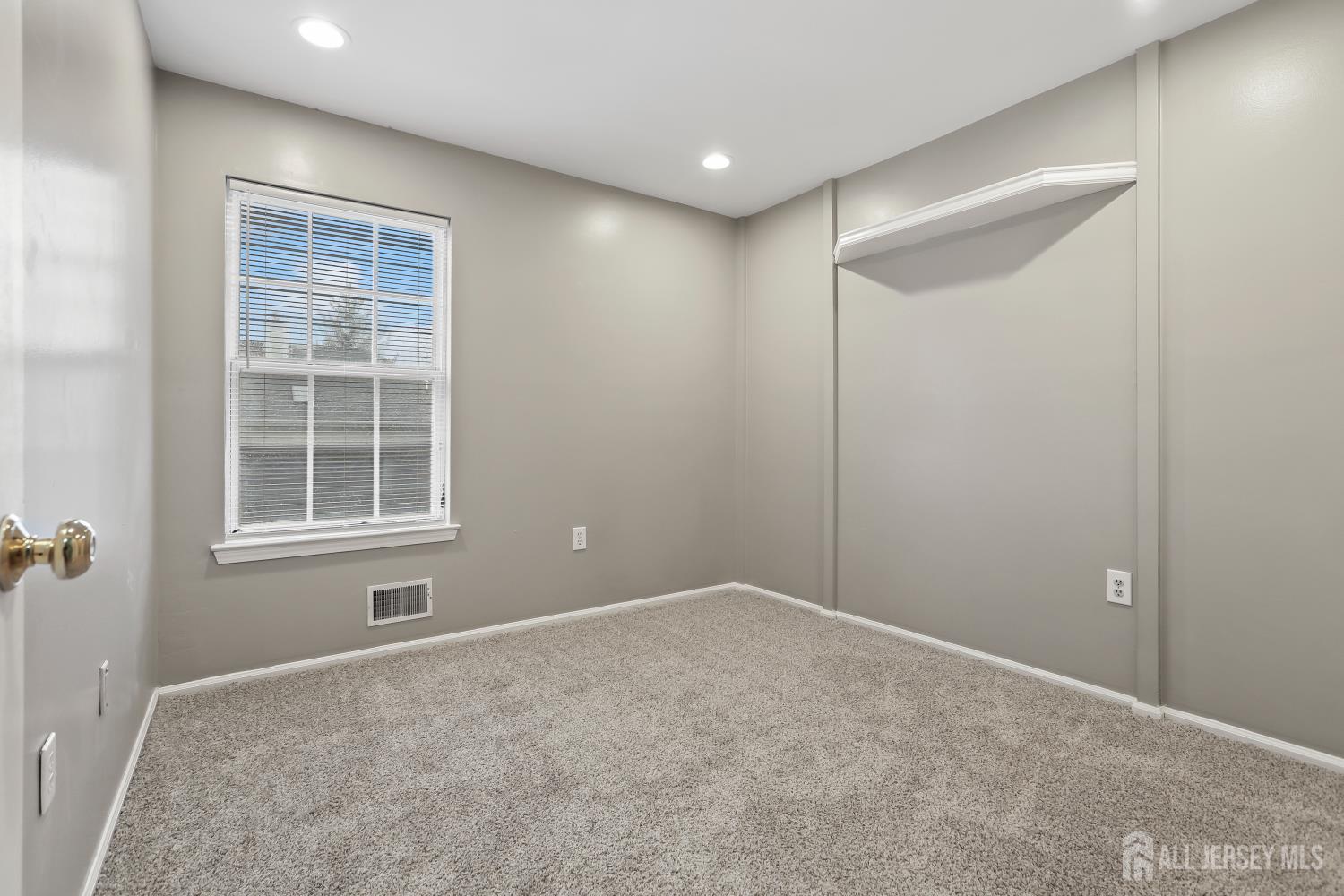 1707 Ridgeview Court Sayreville, NJ 08859 - Photo 13 of 24 a view of an empty room with a window