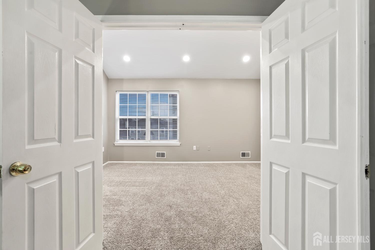 1707 Ridgeview Court Sayreville, NJ 08859 - Photo 19 of 24 a view of an empty room with a window